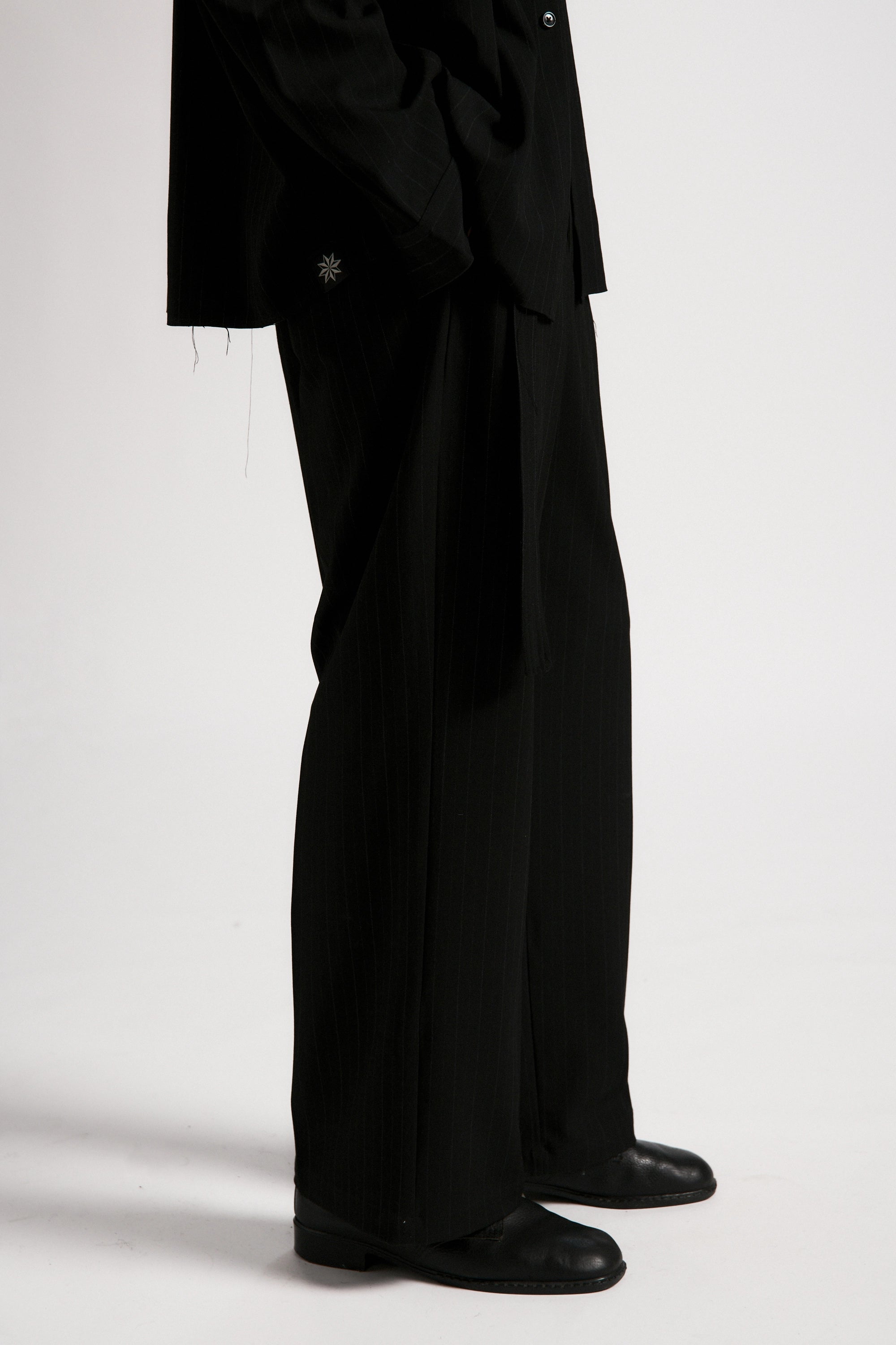 Black suit with a white background