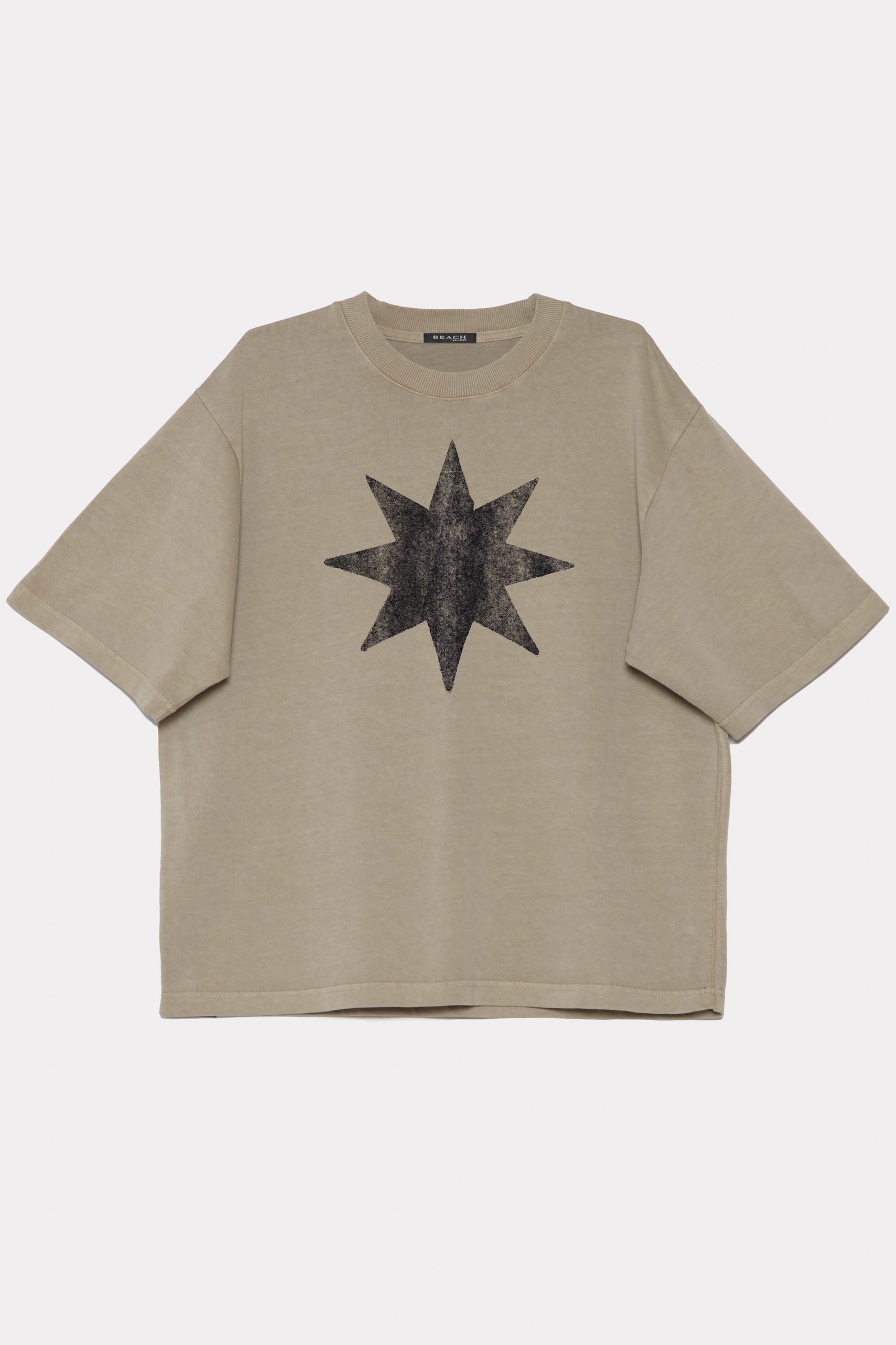 Beige t-shirt made from 320GSM cotton jersey with a black star design on a white background