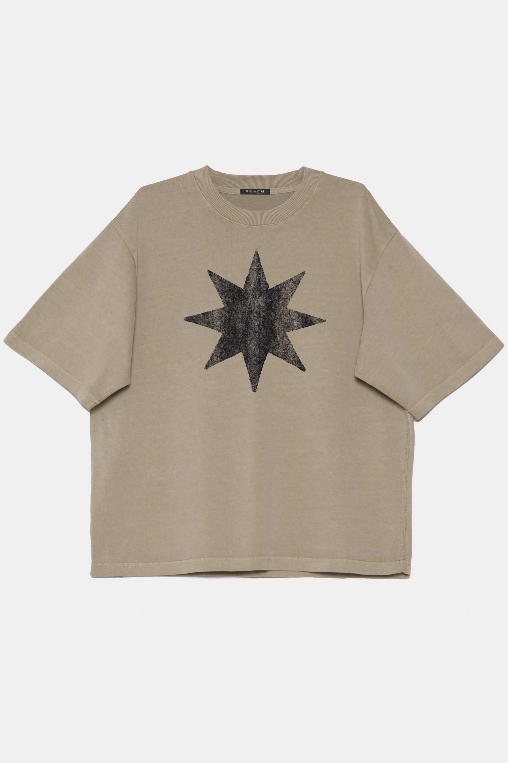 Beige t-shirt made from 320GSM cotton jersey with a black star design on a white background
