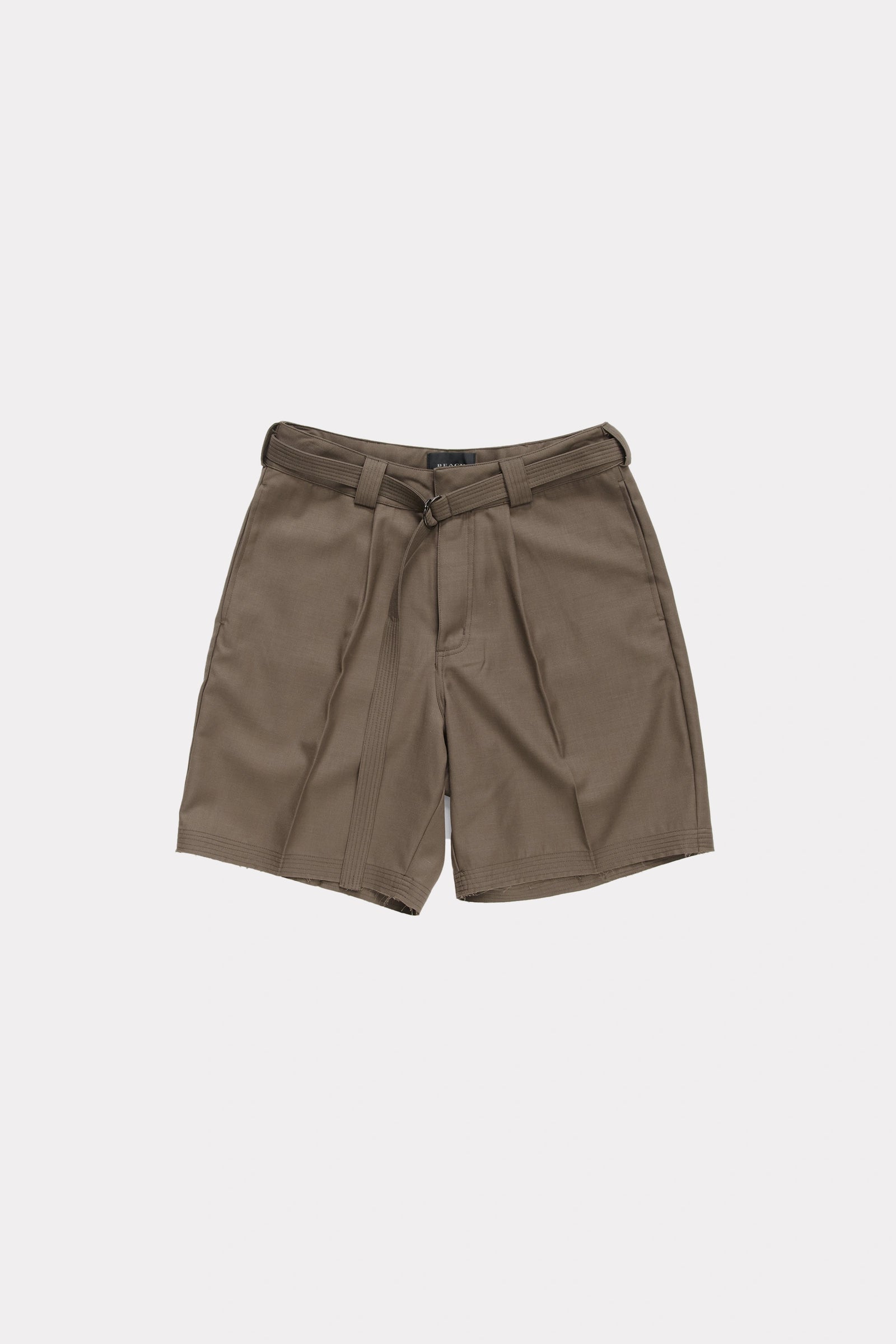 Brown cut shorts with a belt on a light grey background