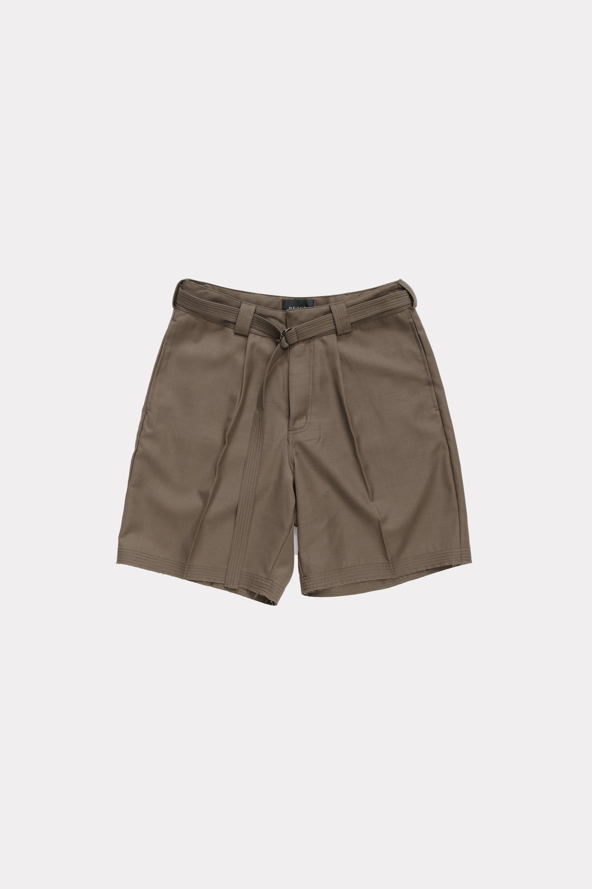 Brown cut shorts with a belt on a light grey background