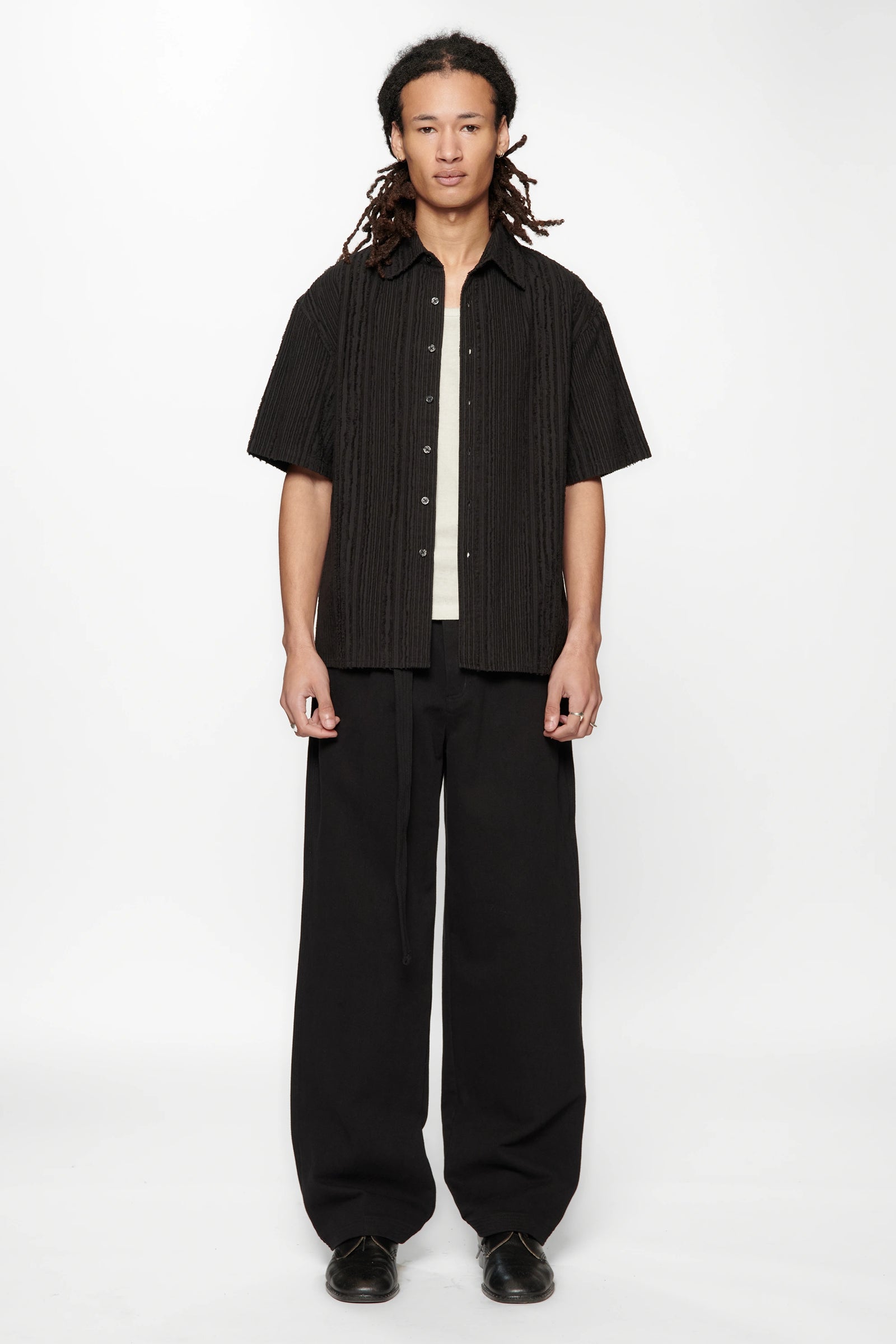 Person wearing the Hold SS Shirt in Black Tux on white background