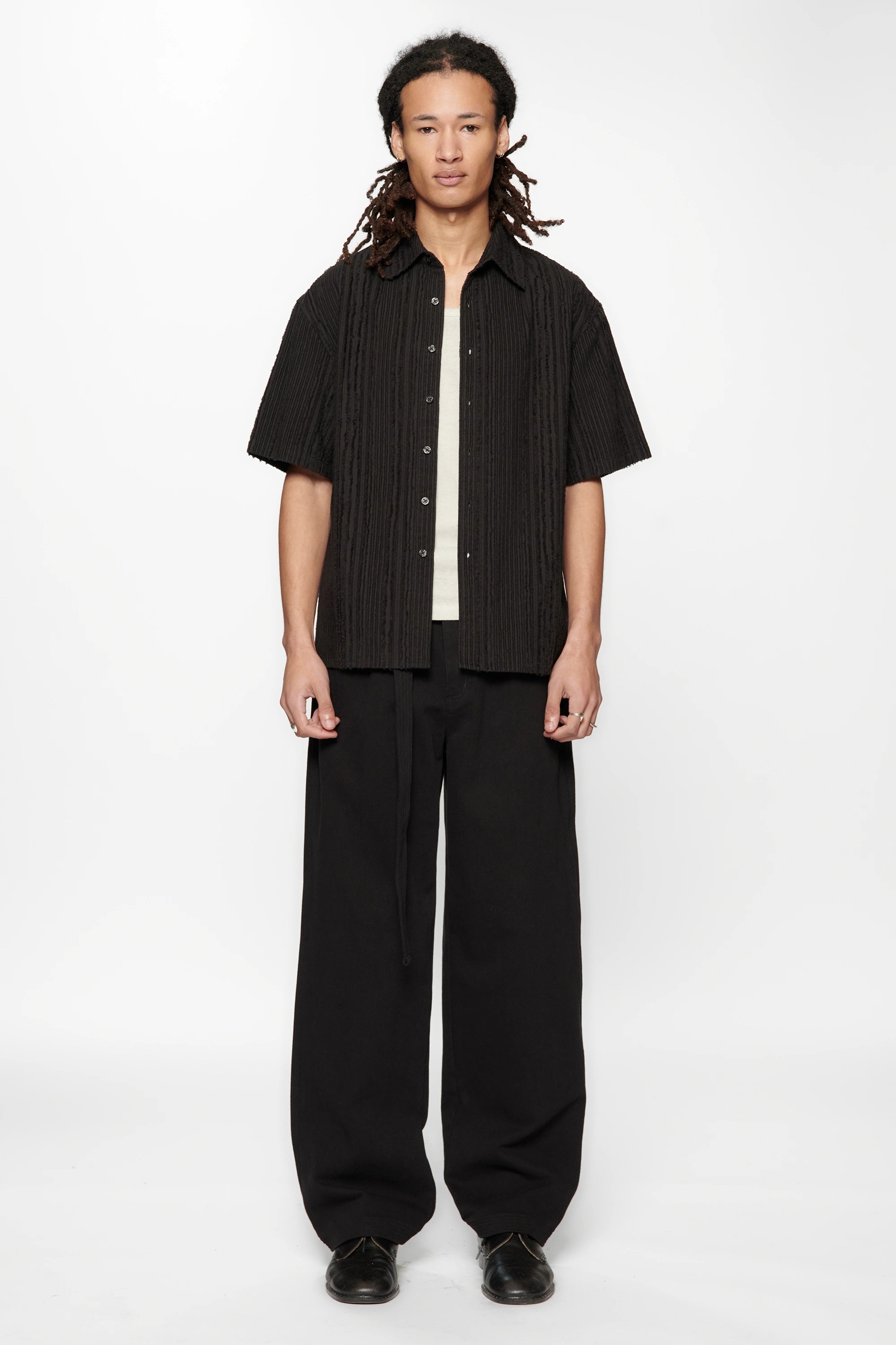 Person wearing the Hold SS Shirt in Black Tux on white background
