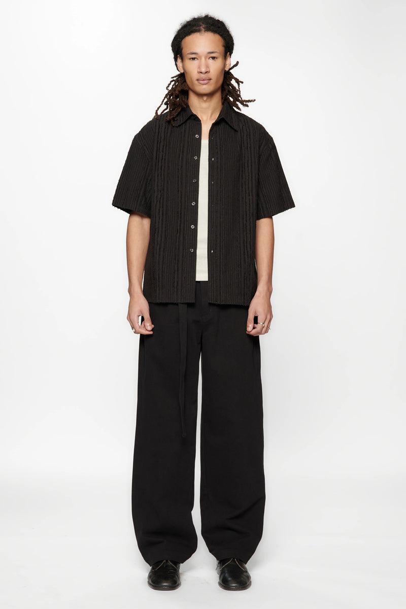 Person wearing the Hold SS Shirt in Black Tux on white background
