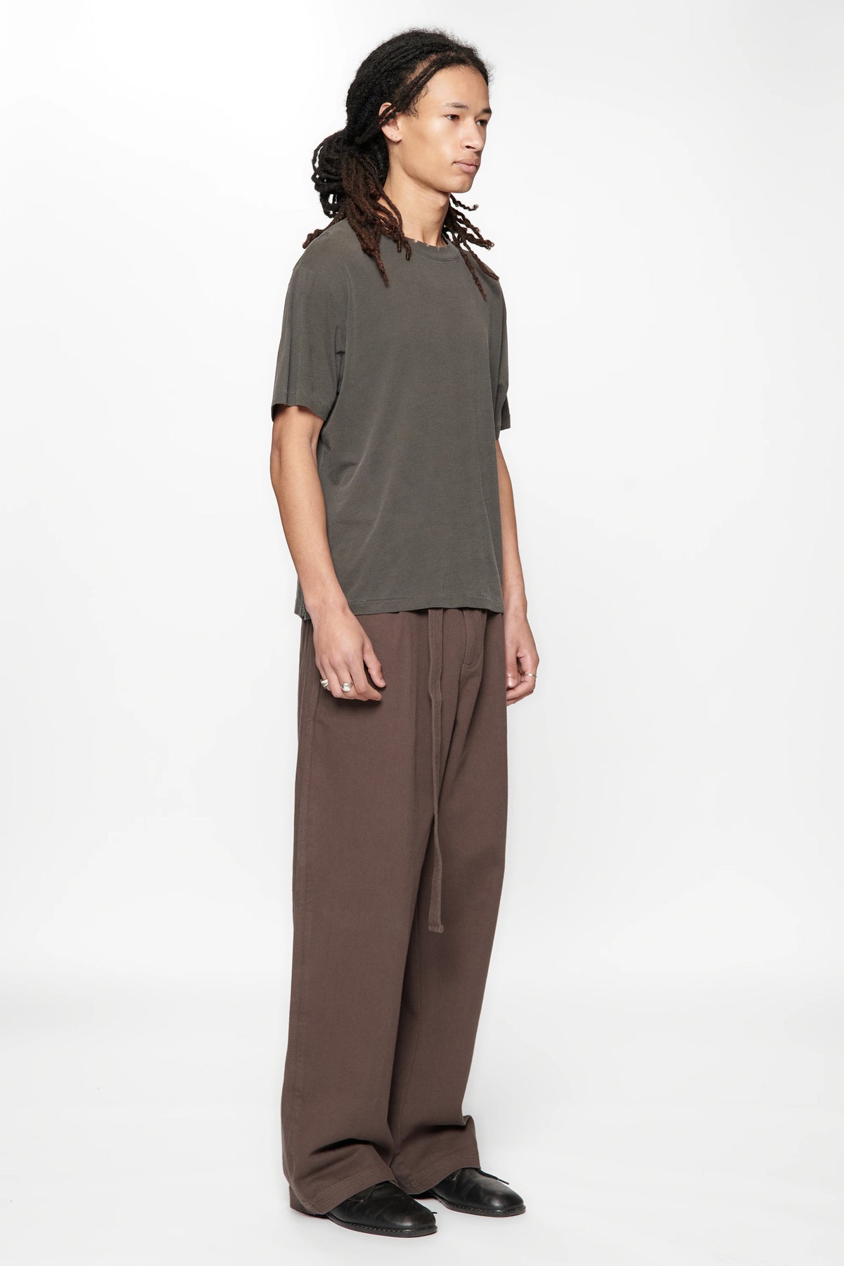 Male figure wearing the Dark Grey Pleated Work Pants on a white background