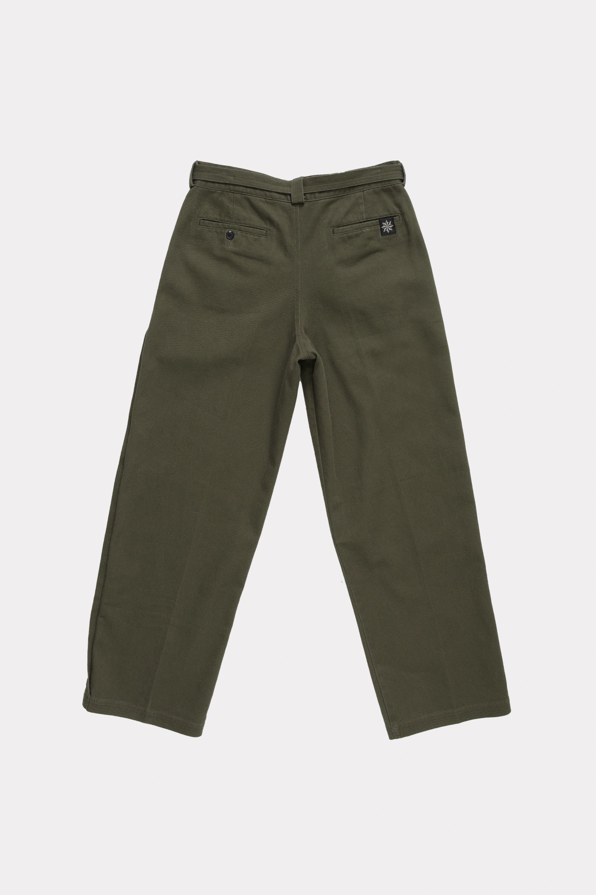 Rear view of a pair of green pleated work pants on a white background
