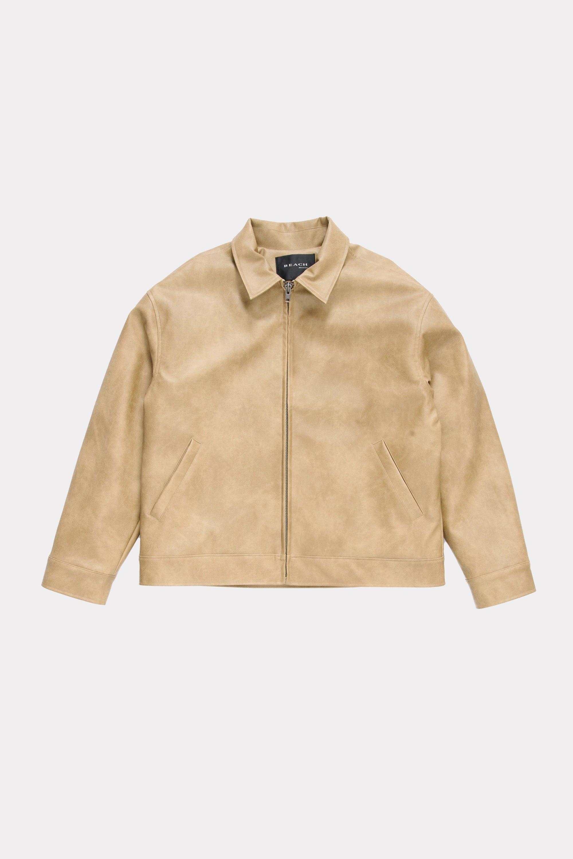 Beige leather jacket on a light grey background