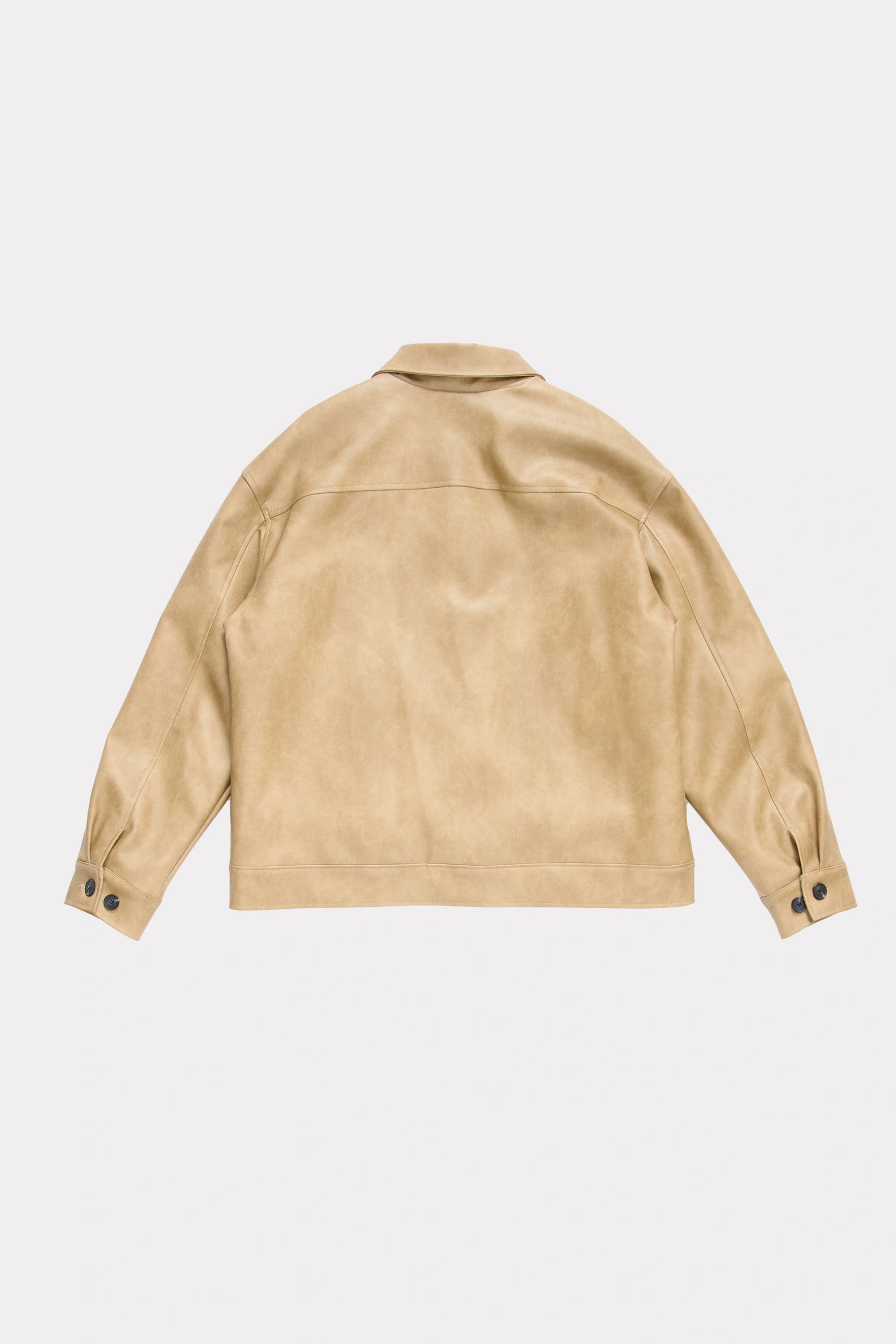 View of the back of a beige leather jacket on a light grey background